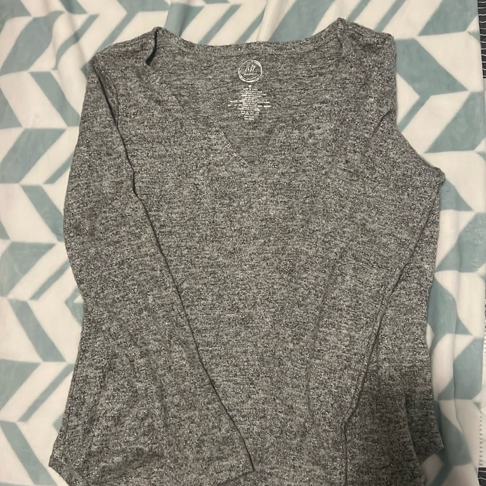 Silver glittery lightweight sweater.  Size Medium.